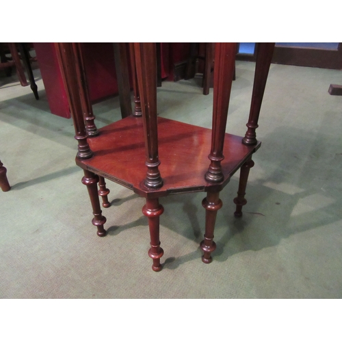 4104 - A late 19th Century French mahogany canted corner side/lamp table, the pierced brass raised gallery ... 