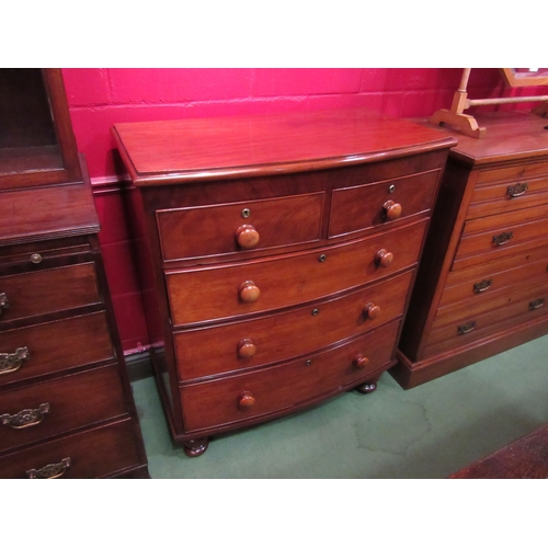 4146 - A circa 1850 flame mahogany bow front chest of two short over three graduating long drawers with bun... 