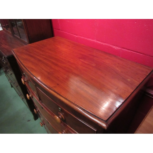 4146 - A circa 1850 flame mahogany bow front chest of two short over three graduating long drawers with bun... 