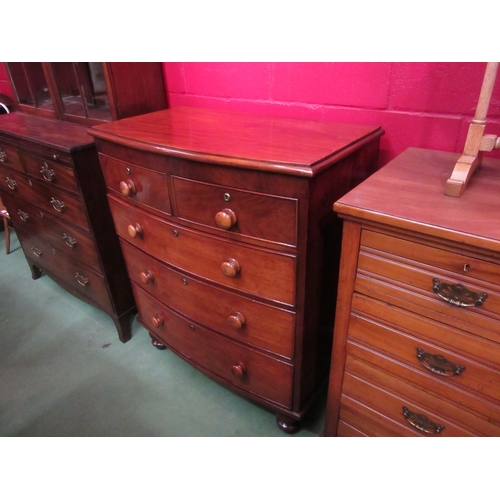 4146 - A circa 1850 flame mahogany bow front chest of two short over three graduating long drawers with bun... 