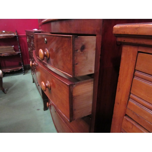 4146 - A circa 1850 flame mahogany bow front chest of two short over three graduating long drawers with bun... 