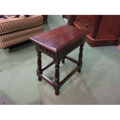 4230 - A 17th Century revival pegged oak stool with carved frieze on turned legs united by stretchers, 50cm... 