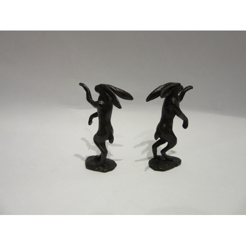 4281 - A pair of bronze boxing hares, 10cm tall