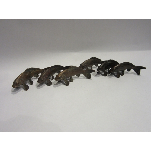 4307 - Six bronze fish by D.Meredith, 10cm long