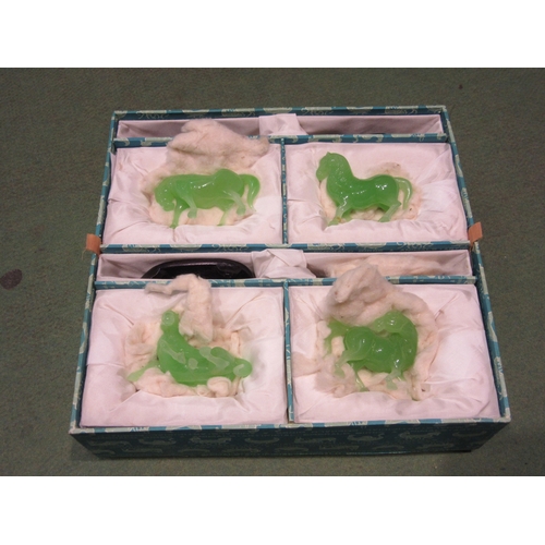 4365 - A collection of eight jade horses with wooden stands, two a/f, boxed