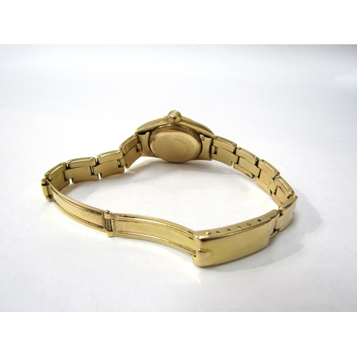 8174 - ROLEX: A Rolex Oyster Perpetual lady's 18ct gold cased wristwatch on an 18ct gold bracelet, gilded d... 