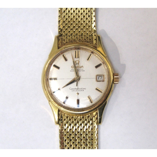 8169 - OMEGA: An 18ct gold cased Omega Constellation Calendar Automatic Chronometer wristwatch on an 18ct g... 