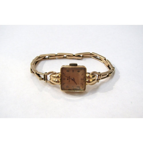 8178 - ROLEX: A mid 20th Century 18ct gold cased ladies Rolex wristwatch on a 9ct gold expandable strap, 17... 