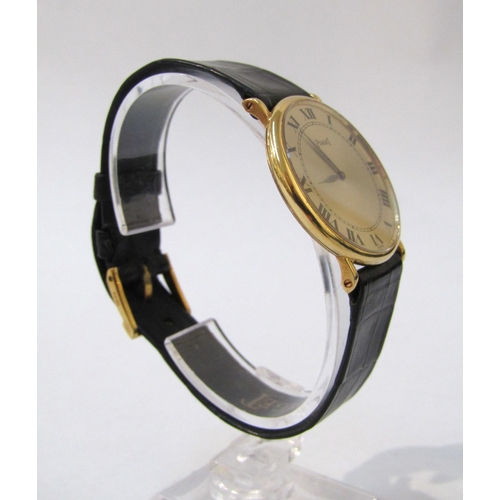 8144 - PIAGET: An 18ct gold thin cased Piaget wristwatch on Piaget reptile leather strap, champagne Roman n... 