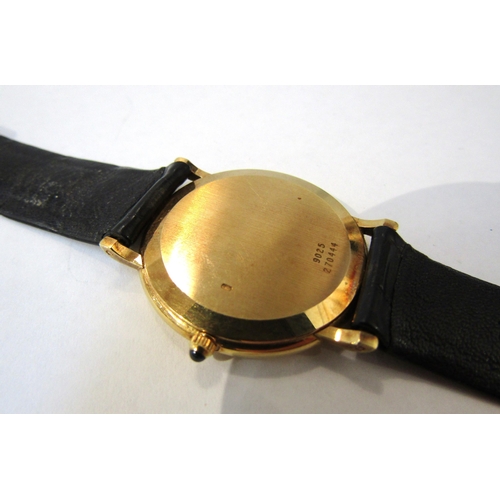 8144 - PIAGET: An 18ct gold thin cased Piaget wristwatch on Piaget reptile leather strap, champagne Roman n... 