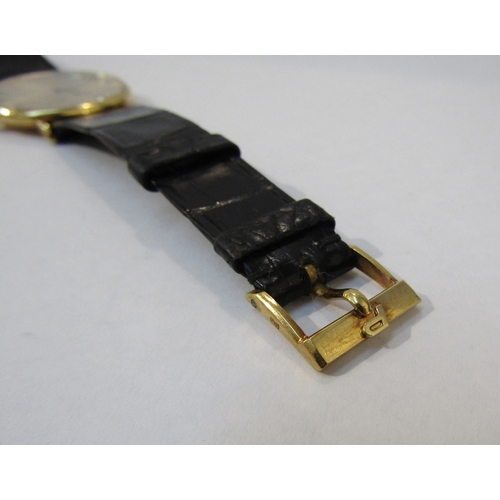 8144 - PIAGET: An 18ct gold thin cased Piaget wristwatch on Piaget reptile leather strap, champagne Roman n... 