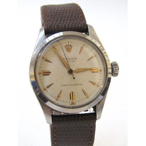 8151 - ROLEX: A Rolex Oyster steel screw back cased gentleman's wristwatch on lizard leather strap, light c... 