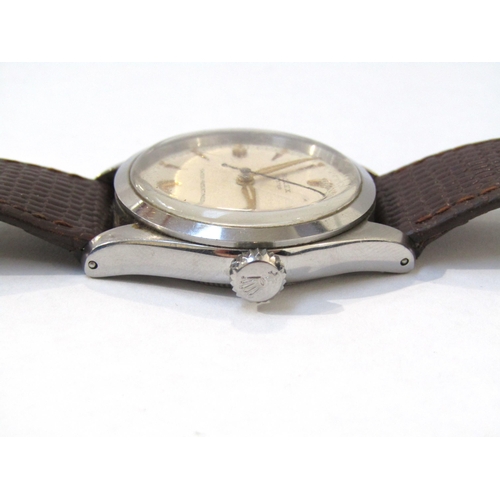 8151 - ROLEX: A Rolex Oyster steel screw back cased gentleman's wristwatch on lizard leather strap, light c... 