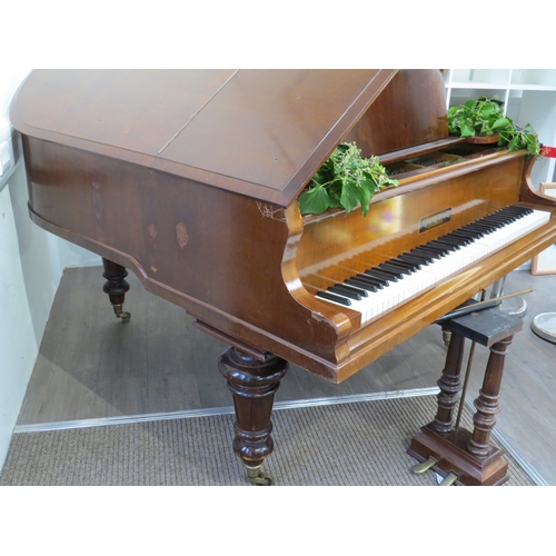 5025 - A C. Kemmler & Co. of Osnabruck baby grand piano, walnut cased, raised on turned and reeded supports... 