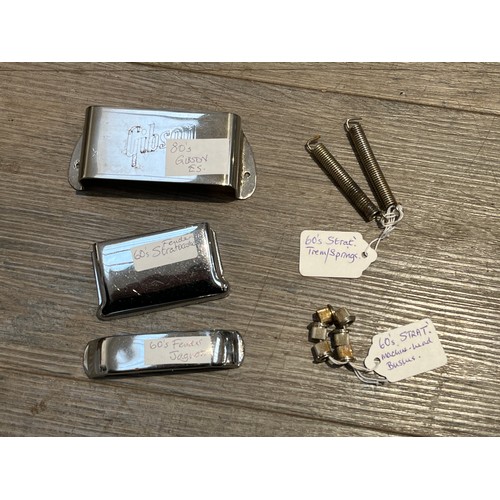 5098 - A quantity of Fender and Gibson guitar parts including machine head bushes and bridge covers