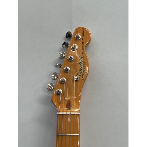 5076 - A Fender Squier Thinline Telecaster, green body, made in Indonesia, serial number 155122008922