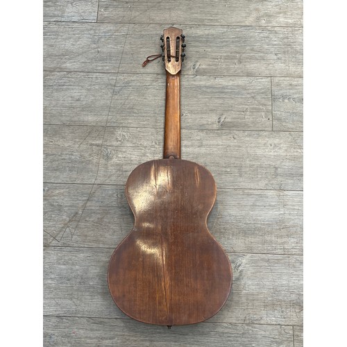 5030 - A Macedonian parlour style acoustic guitar, label marked Popravljeno 1955 STEVAN S. BELI STRUCNA MUZ... 