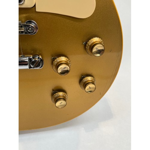 5111 - A circa 1973-75 Gibson USA Les Paul Deluxe model 'Gold Top' electric guitar, serial number 898859, w... 