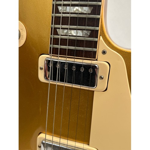 5111 - A circa 1973-75 Gibson USA Les Paul Deluxe model 'Gold Top' electric guitar, serial number 898859, w... 