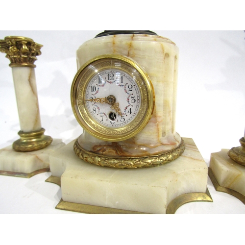 8059 - A French marble and gilt metal mantel timepiece, the marble pedestal base with white enamel Arabic n... 