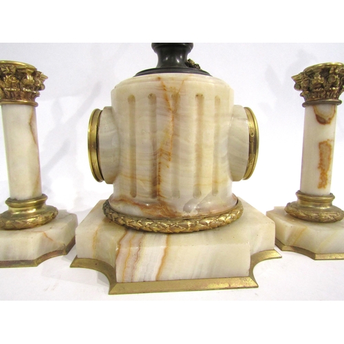 8059 - A French marble and gilt metal mantel timepiece, the marble pedestal base with white enamel Arabic n... 