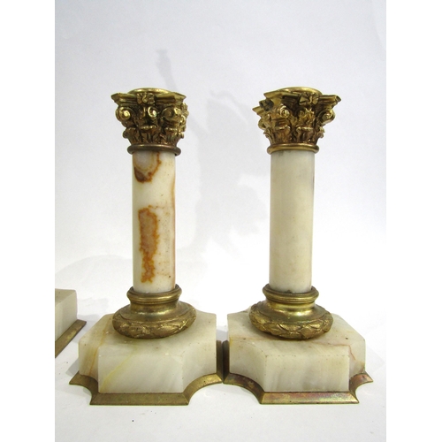 8059 - A French marble and gilt metal mantel timepiece, the marble pedestal base with white enamel Arabic n... 