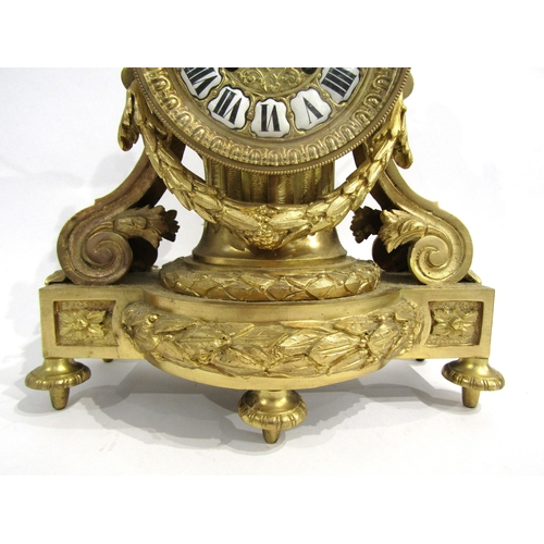 8036 - A 19th Century French gilt metal mantel clock, the movement drum held by a column, with acanthus and... 