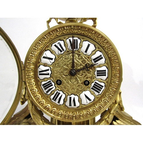 8036 - A 19th Century French gilt metal mantel clock, the movement drum held by a column, with acanthus and... 