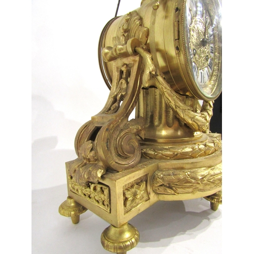 8036 - A 19th Century French gilt metal mantel clock, the movement drum held by a column, with acanthus and... 