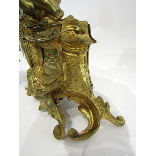 8063 - A 19th Century French gilt metal mantel clock, scroll and shell form design with white enamel and bl... 