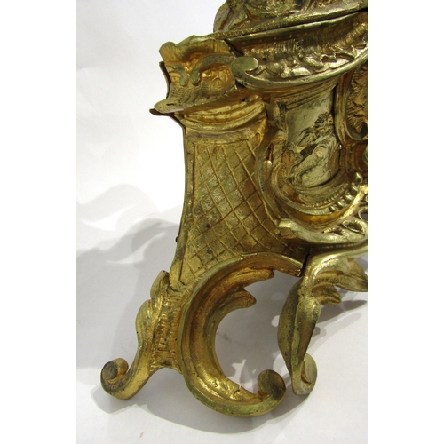 8063 - A 19th Century French gilt metal mantel clock, scroll and shell form design with white enamel and bl... 