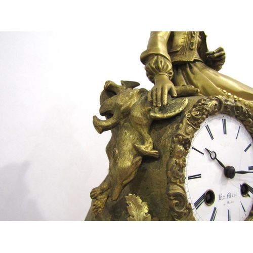 8047 - A 19th Century French gilt metal mantel clock by Henry Marc of Paris, the ornate base with dog head ... 