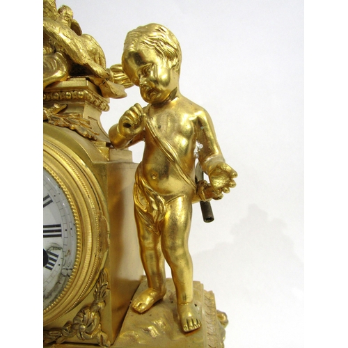 8060 - A 19th Century French ormolu/gilt metal mantel clock, the white enamel Roman numeral dial with outer... 