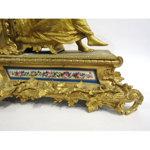 8062 - A French gilt metal mantel clock, leaf decorated base with porcelain floral design panels, surmounte... 