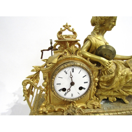 8062 - A French gilt metal mantel clock, leaf decorated base with porcelain floral design panels, surmounte... 