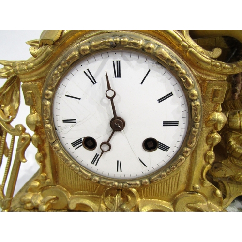 8062 - A French gilt metal mantel clock, leaf decorated base with porcelain floral design panels, surmounte... 