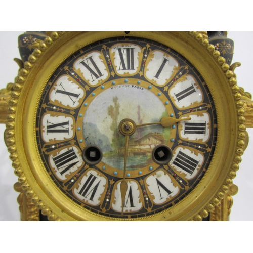 8051 - A 19th Century French gilt metal mantel clock, various waterside and village scene panels, with cent... 