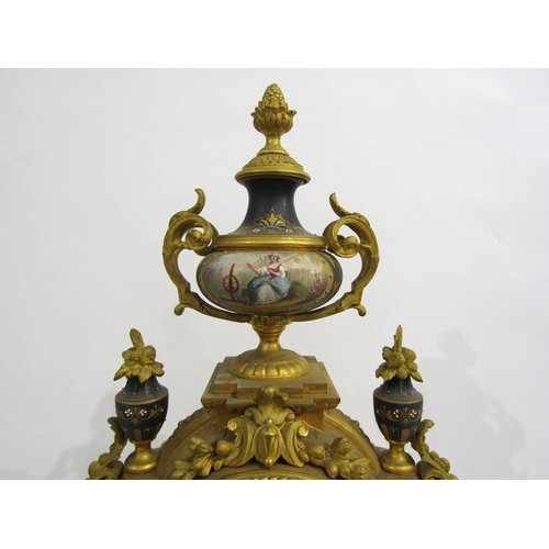 8051 - A 19th Century French gilt metal mantel clock, various waterside and village scene panels, with cent... 