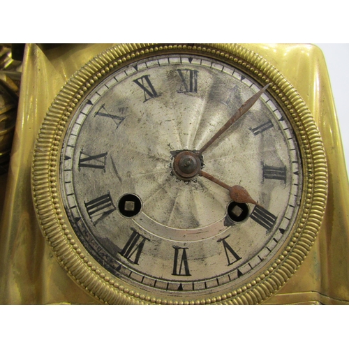 8043 - A large 19th Century gilt metal mantel clock, he ornate scroll design base surmounted by a distingui... 