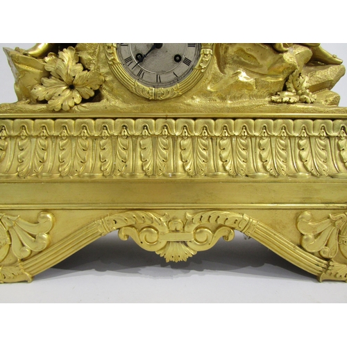 8045 - A large early 19th Century French ormolu/gilt metal mantel clock, the ornately designed floral and s... 