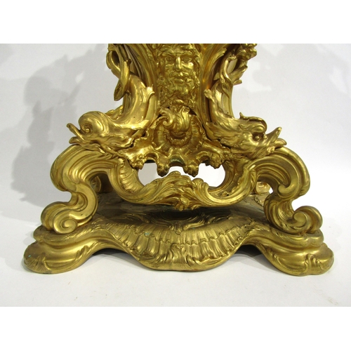 8042 - A large Rococo Louis XV style ormolu/gilt metal mantel clock, ornate design with central green man a... 