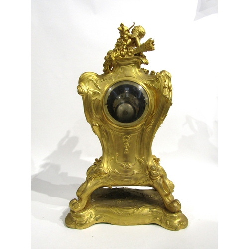 8042 - A large Rococo Louis XV style ormolu/gilt metal mantel clock, ornate design with central green man a... 