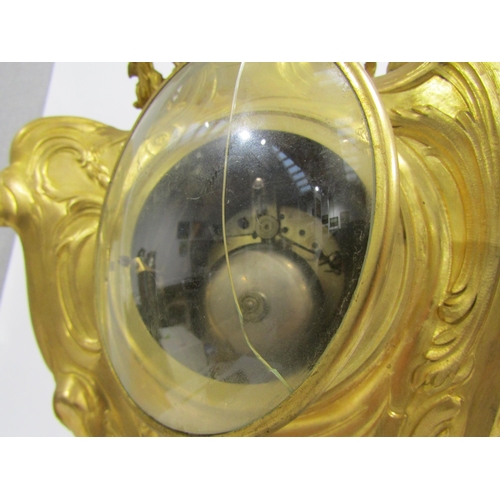 8042 - A large Rococo Louis XV style ormolu/gilt metal mantel clock, ornate design with central green man a... 