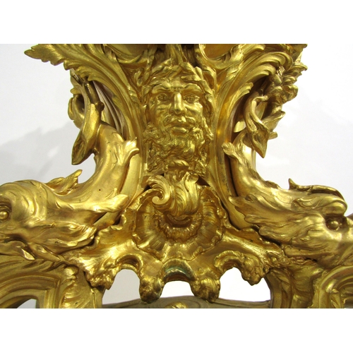 8042 - A large Rococo Louis XV style ormolu/gilt metal mantel clock, ornate design with central green man a... 