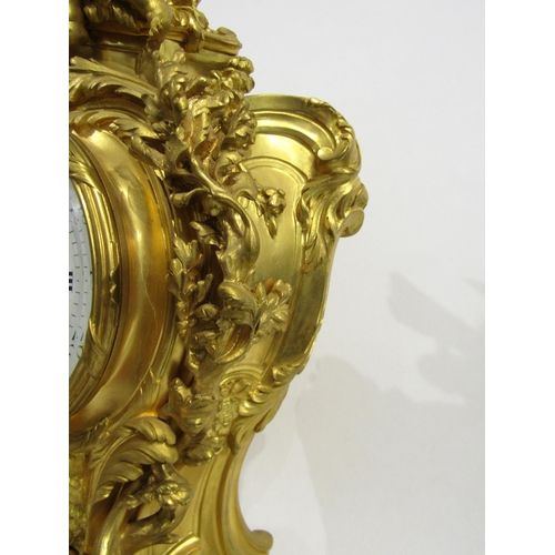 8042 - A large Rococo Louis XV style ormolu/gilt metal mantel clock, ornate design with central green man a... 