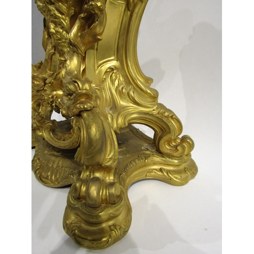 8042 - A large Rococo Louis XV style ormolu/gilt metal mantel clock, ornate design with central green man a... 