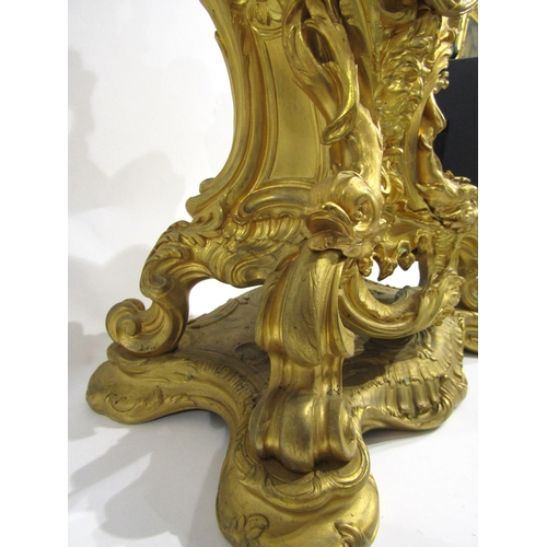 8042 - A large Rococo Louis XV style ormolu/gilt metal mantel clock, ornate design with central green man a... 