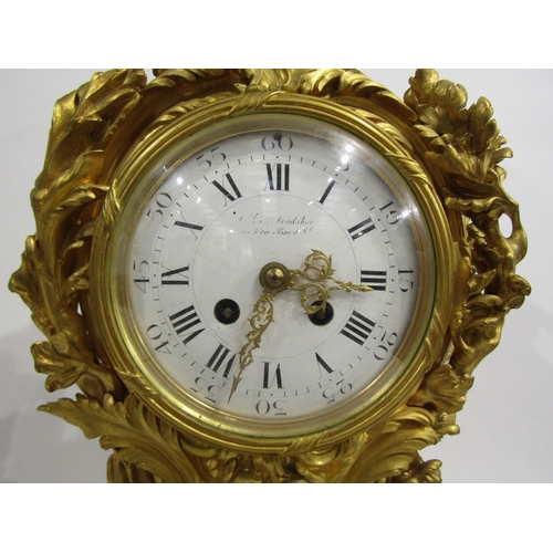 8042 - A large Rococo Louis XV style ormolu/gilt metal mantel clock, ornate design with central green man a... 