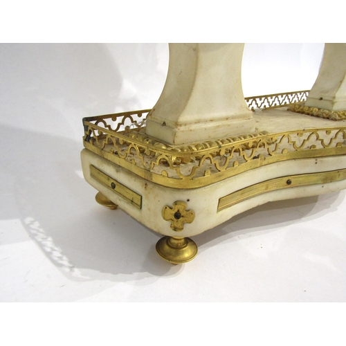 8052 - An early 19th Century French composite marble and gilt metal portico form mantel clock, the white en... 