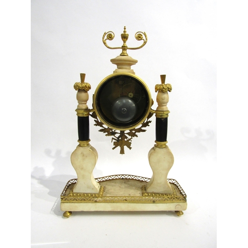 8052 - An early 19th Century French composite marble and gilt metal portico form mantel clock, the white en... 